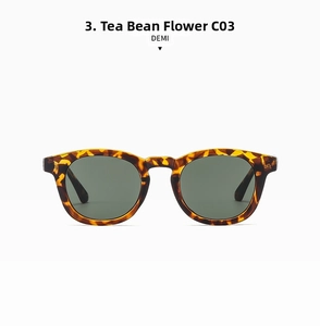Detailed macro view of DEMI leopard print round sunglasses with dark green lenses