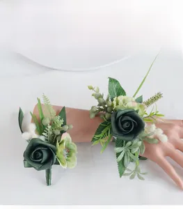 Detail of dark green PE rose boutonniere and wrist corsage set for outdoor weddings
