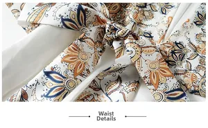 Detalles de cintura del vestido paisley vintage con elegante diseño de nudo y lazo