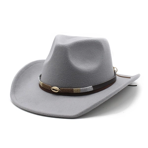Detail of wool fedora hat with brown leather band and golden shell metal decoration