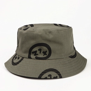 Detail of army green cotton bucket hat with black abstract patterns and clean stitching