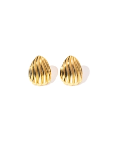 Macro detail of gold-plated titanium steel earrings with retro vertical ribbed texture