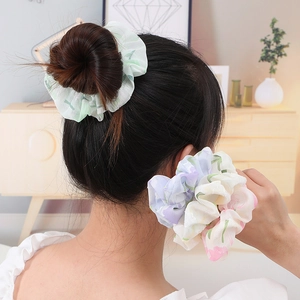 Elegant floral chiffon scrunchie set in soft green and lavender for hair styling