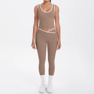 Detail of high-waist yoga pants with cross-waist design and white contrast piping accents
