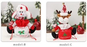 Detail of Christmas snowman and reindeer drawstring gift bags with plush doll decorations