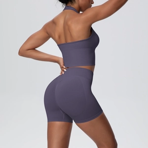 Detail of high-waist ribbed seamless yoga shorts with push-up effect in purple