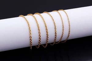 Macro shot of gold-plated stainless steel cable chain with a high-polished mirror finish