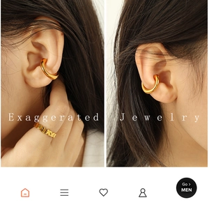 Detailed view of polished golden C-shape ear cuff jewelry on ear with glossy finish