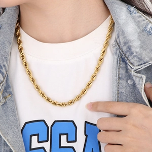 Detailed view of model wearing a 18K gold plated titanium rope chain necklace