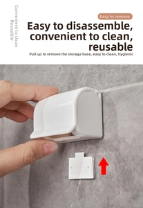 Close-up of detachable white wall-mounted razor holder showing easy removal for cleaning
