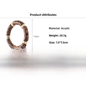 Detail view of leopard print acrylic bracelet with gold metal beads and size parameters