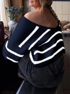 Rear view of women's off-shoulder striped knit sweater in navy blue and white