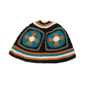 Close-up of handmade crochet granny square bucket hat showing intricate knit patterns