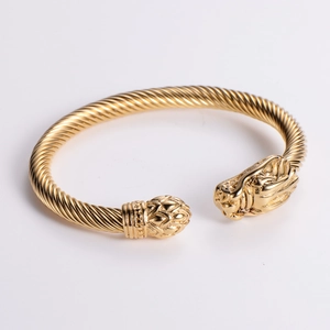 18k gold plated stainless steel twisted cable open bracelet with embossed dragon heads