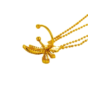 Golden butterfly cartilage ear cuff with micro-paved zircons on a white background