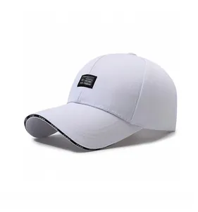 Detailed side view of a white baseball cap with embroidered patch and lettered brim