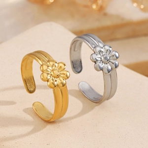 Minimalist 18K gold and silver plated adjustable daisy flower rings on stone surface