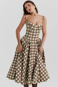 Detail of French corset style plaid dress with green and red check pattern and full skirt