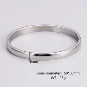 Detail showing 6mm width and 58x50mm inner diameter dimensions of the silver bangle