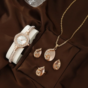 Detailed set featuring a golden quartz watch with pink gemstones and matching jewelry