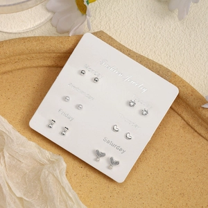 6-pair silver tone stud earring set with pearls and hearts on weekly display card