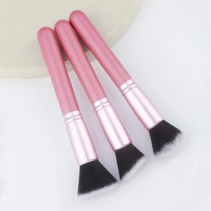Angled flat top foundation brushes with pink matte handles and soft bicolored bristles