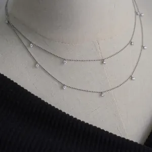 Silver titanium steel necklace with sparkling star zircon pendants on a bead chain