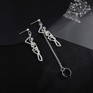Vintage punk silver skull earrings with asymmetrical long chains and ear bone clips