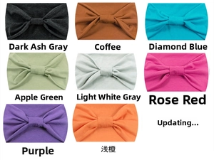 Detailed close-up of elastic yoga headbands in multiple colors with knot design