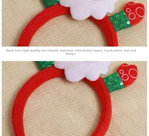 Detail of red Christmas headband with green sequins and white cloud decor on fabric