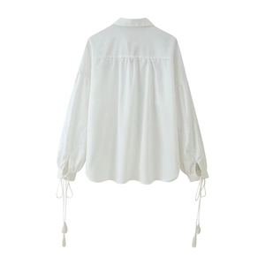 Women's white cotton linen set with embroidered tassels and loose pants, back view