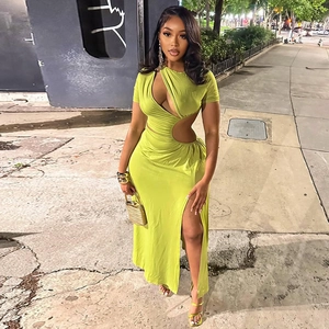 Detail of lime green ruched dress featuring side waist cut-out and high slit leg design