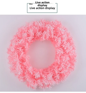 Detailed top view of a pink and white festive wreath made of soft decorative fibers