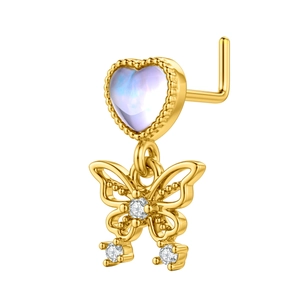 Detail of 18k gold L-shape nose stud featuring a heart stone and butterfly pendant