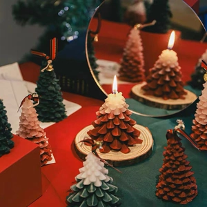 Scented Christmas tree candles in forest green and red gradient for holiday decor
