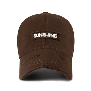 Vintage brown washed baseball cap with Sunshine embroidery and distressed brim detail