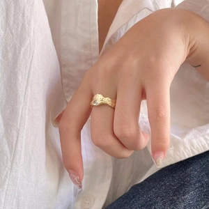 Irregular lava texture S925 silver ring with zircon in gold finish worn by model