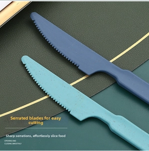 Close-up of serrated wheat straw knives in blue colors with matte speckled texture