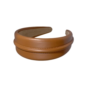 Brown faux leather headband with double-layered stitching and high-crown design