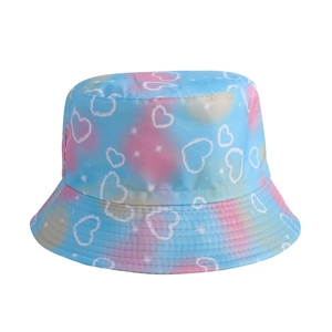 Detail of blue and pink tie-dye bucket hat with white heart pattern and fabric texture