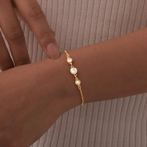Elegant gold stainless steel chain bracelet for women featuring three round clear zircons