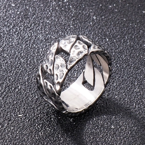 Macro shot of silver stainless steel ring with vintage hammered chain link texture