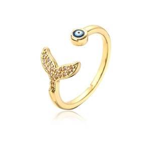 Close-up of 18K gold ring with evil eye bead and cubic zirconia fishtail detail