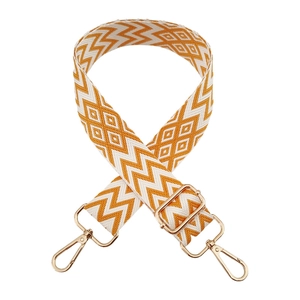 Detail of yellow and white woven wide shoulder strap with gold metal swivel snap hooks