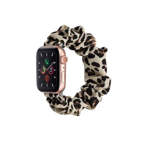Close-up of leopard print scrunchie watch strap for smartwatches with rose gold casing
