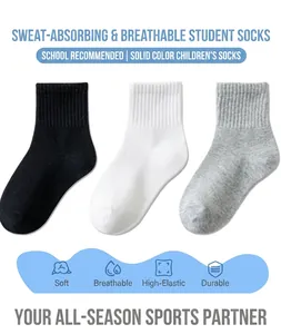 Detailed view of breathable cotton crew socks in solid black, white, and grey colors
