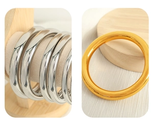Detailed mirror-polished finish on minimalist gold and silver stackable bangles