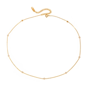 Elegant 18K gold chain necklace with delicate diamond pendants in a circular layout