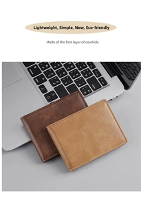 Detail of slim cowhide leather wallets showing matte texture and fine stitching on a laptop