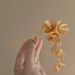 Elegant French gold floral hair pin with hollow flowers and petal tassels for women